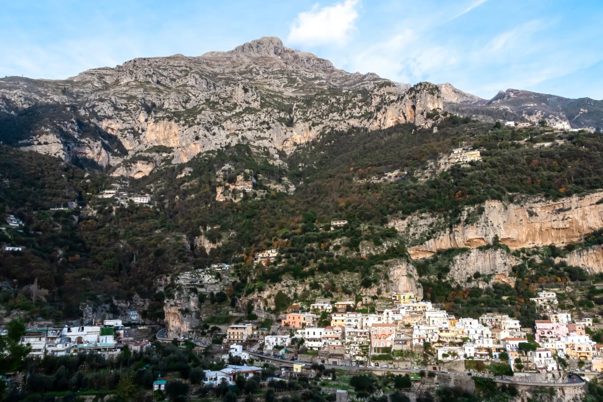 Panoramic view from coastal town Positano on mountain peaks of Monte San Michele, Molare, Canino, Caldare in Lattari Mountains, Apennines, Amalfi Coast, Italy, Europe. Parts of upper Positano village